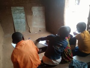 Children studying in a rural classroom in Kifumbira Uganda
