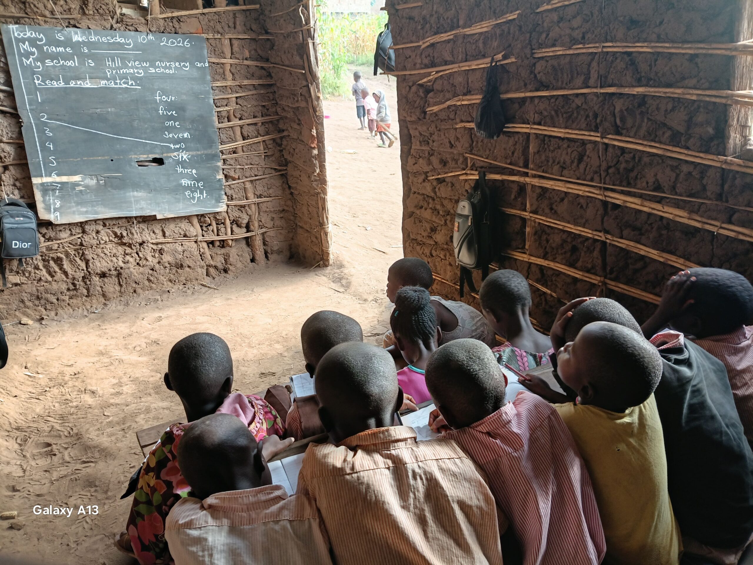 Children learning reading and number matching in a rural classroom at Hill View Nursery and Primary School in Kifumbira, Uganda